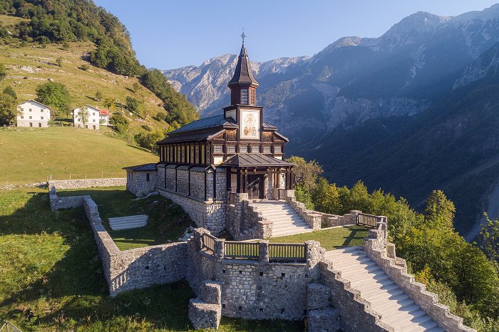 View of the exterior of the memorial church made of wood and stone.